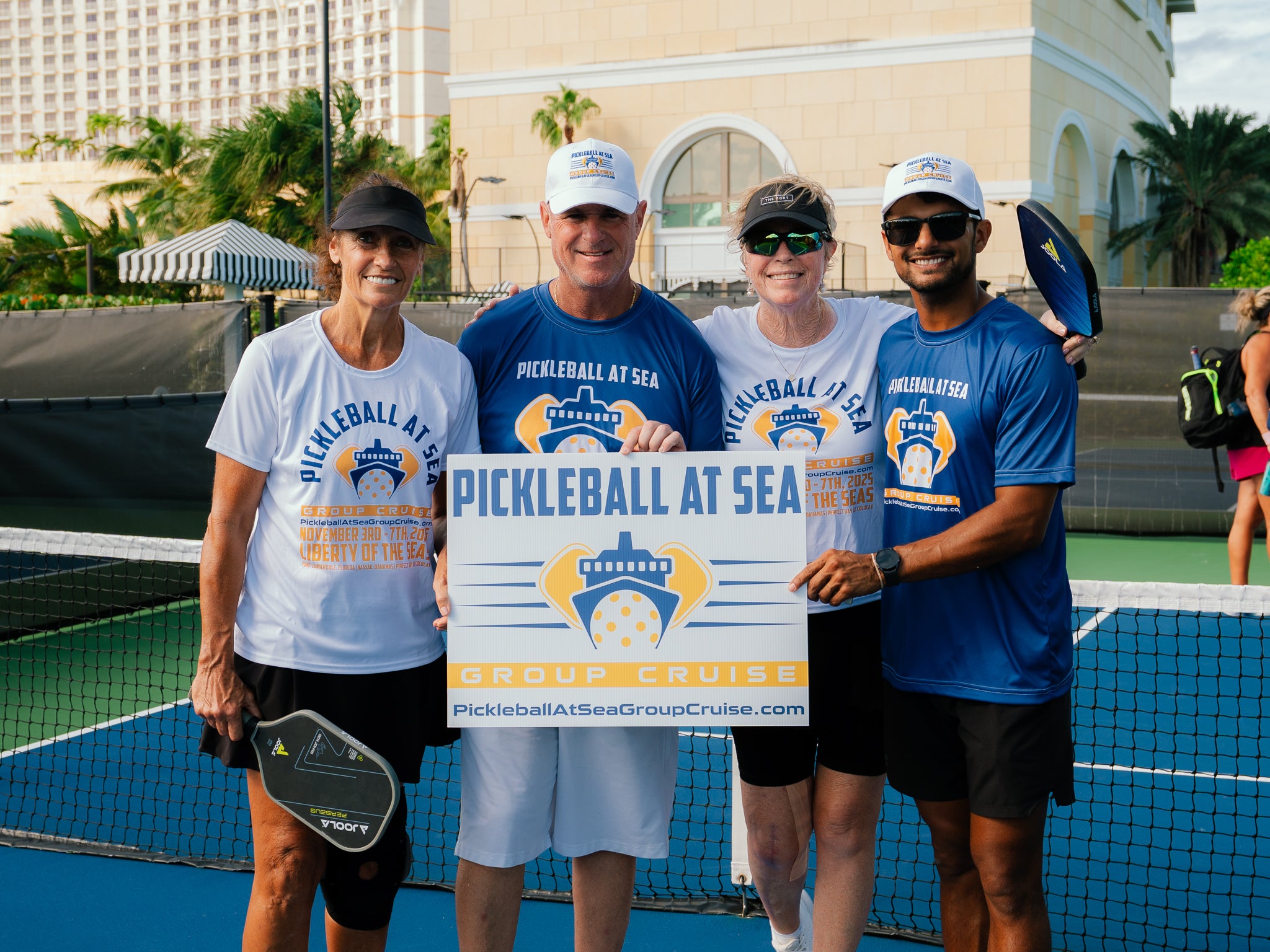 Pickleball At Sea Group Cruise Guests and Pickleball Pros enjoying their Pickleball vacation ashore in Nassau, Bahamas wearing branded Pickleball At Sea Group Cruise shirts and hats.