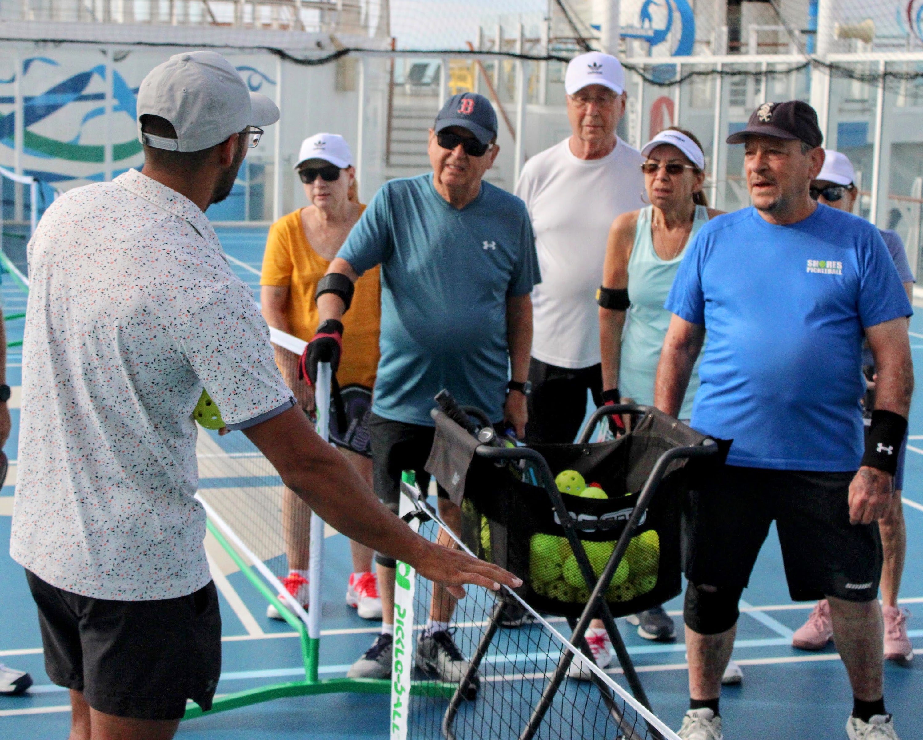 Pickleball At Sea Group Cruise Guests gathered for instruction during a Caribbean Pickleball vacation